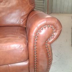 2 tone leather love seat with tufted ends
