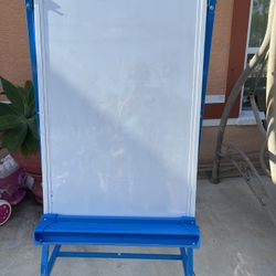 Blackboard in good condition with 4 wheels for transport and the metal frame is like new. It measures 60 inches high and 27 inches wide.