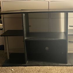black desk  with 4 standing Shelves