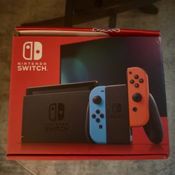 NINTENDO SWITCH WITH NEON BLUE AND RED JOY-CON