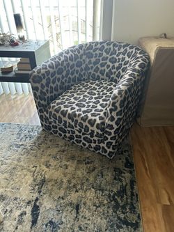 Stylish leopard print armchair in excellent condition. 