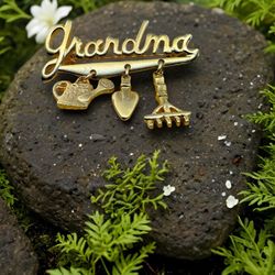 The Grandma Goldtone Garden Charm Brooch Shovel ,Water Jug, & Rake 2 1/8 Inches