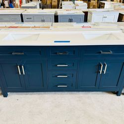 Brand new bathroom vanity in Navy Blue “72" double sink, soft close and solid wood. 6 Drawers, 4 doors with electrical outlets and Marble top in white