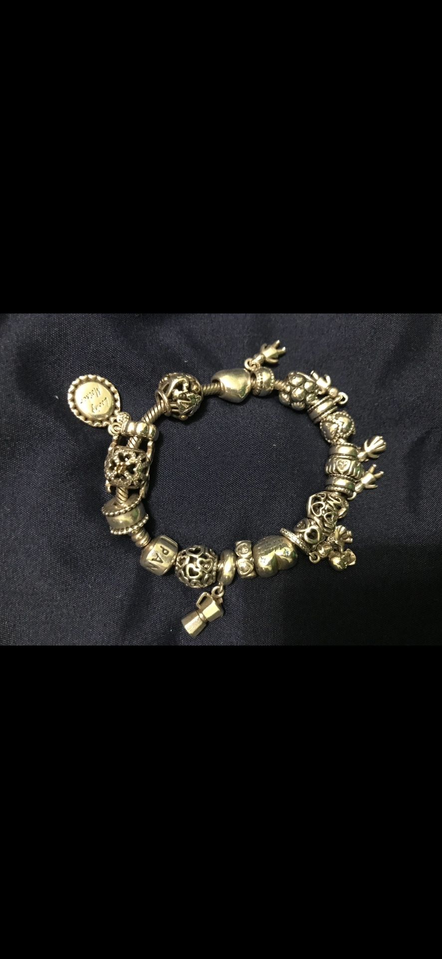 Pandora bracelet with limited edition charms over 19 charms on it authentic