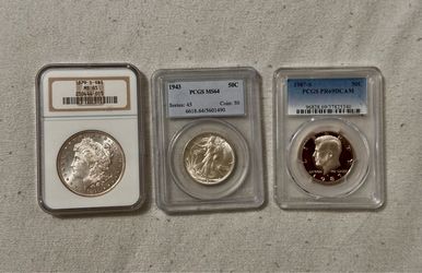 Lot of 3.  1879s Morgan, 1943  & 11987s half dollar