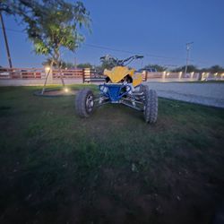 Yellow and Blue Sport ATV Four Wheeler