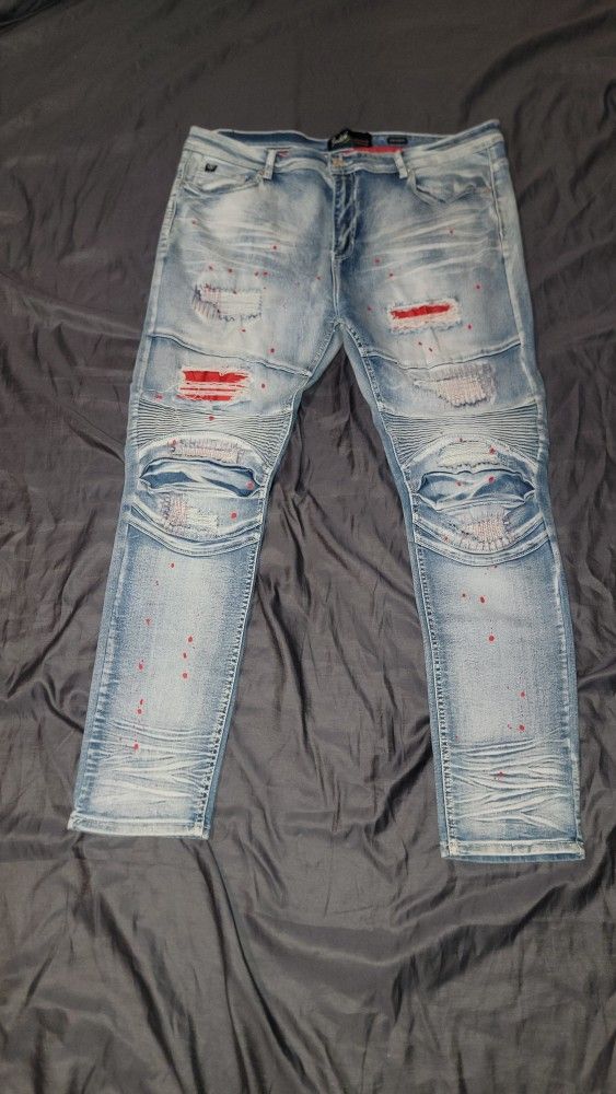 SWITCH REMARKABLE DISTRESSED DENIM JEANS WITH RED SPOTS
