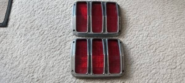 Mustang 1964 tail lights O.E.M fomoco

Original pair very good condition,bezels and lenses included -no cracks...lenses say "SAE-TSDB-64-CR"...check p