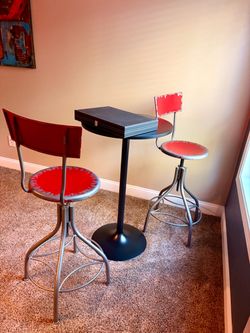Like New Bistro Table with 2 Red/Steel Swivel Bar Stools