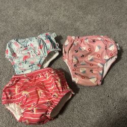 Lot of 3 Green Sprouts and I play Swim Diapers one 6 Months two 12 months