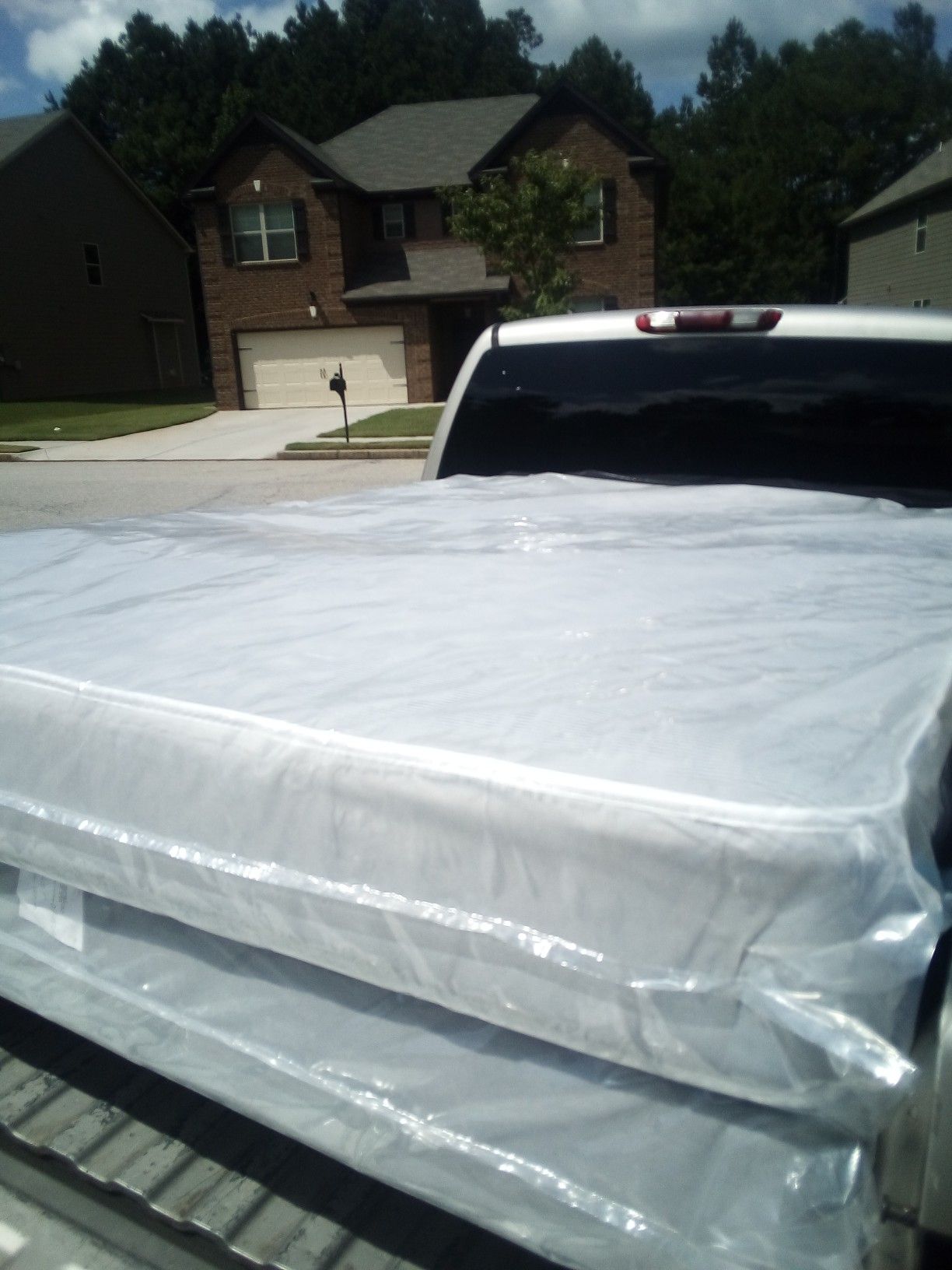 Queen mattress and box spring in the plastic new free delivery in Atlanta