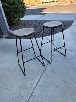 Two rustic barstools
