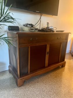 Record cabinet. Uncertain if record player or stereo works it’s currently being used as a vintage video game system cabinets but be awesome to use as
