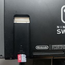 Nintendo Switch Black 64 GB With Super Mario U Deluxe