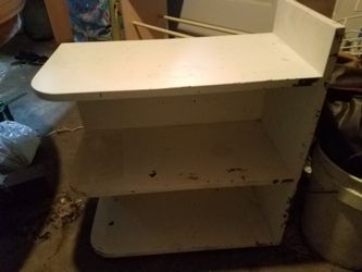 Unique, crafty, table with 2 shelves.