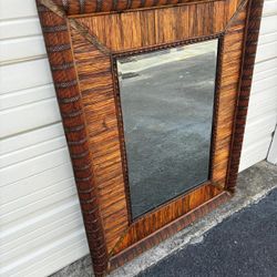 Beautifully crafted wooden frame mirror.  Wicker  frame mirror solid wood back… beveled mirror 39 “ x 50 “ $295