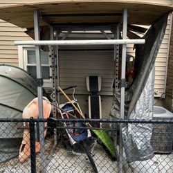 Commercial squat rack with olympic wight set, 2 bars, and 3benches.