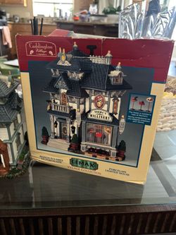 retired 2004 Lemax Village Collection lighted porcelain building titled "Norma's Millinery"