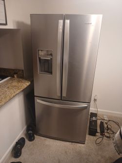 Grey Whirlpool Brand Refrigerator