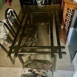 glass table with 5 chairs