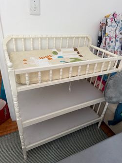 Diaper changing table with shelving