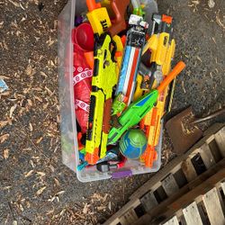 Bin of Nerf guns and other stuff