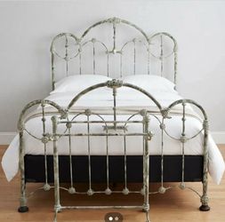Antiqued Anthropologie iron bed frame and blanket rack