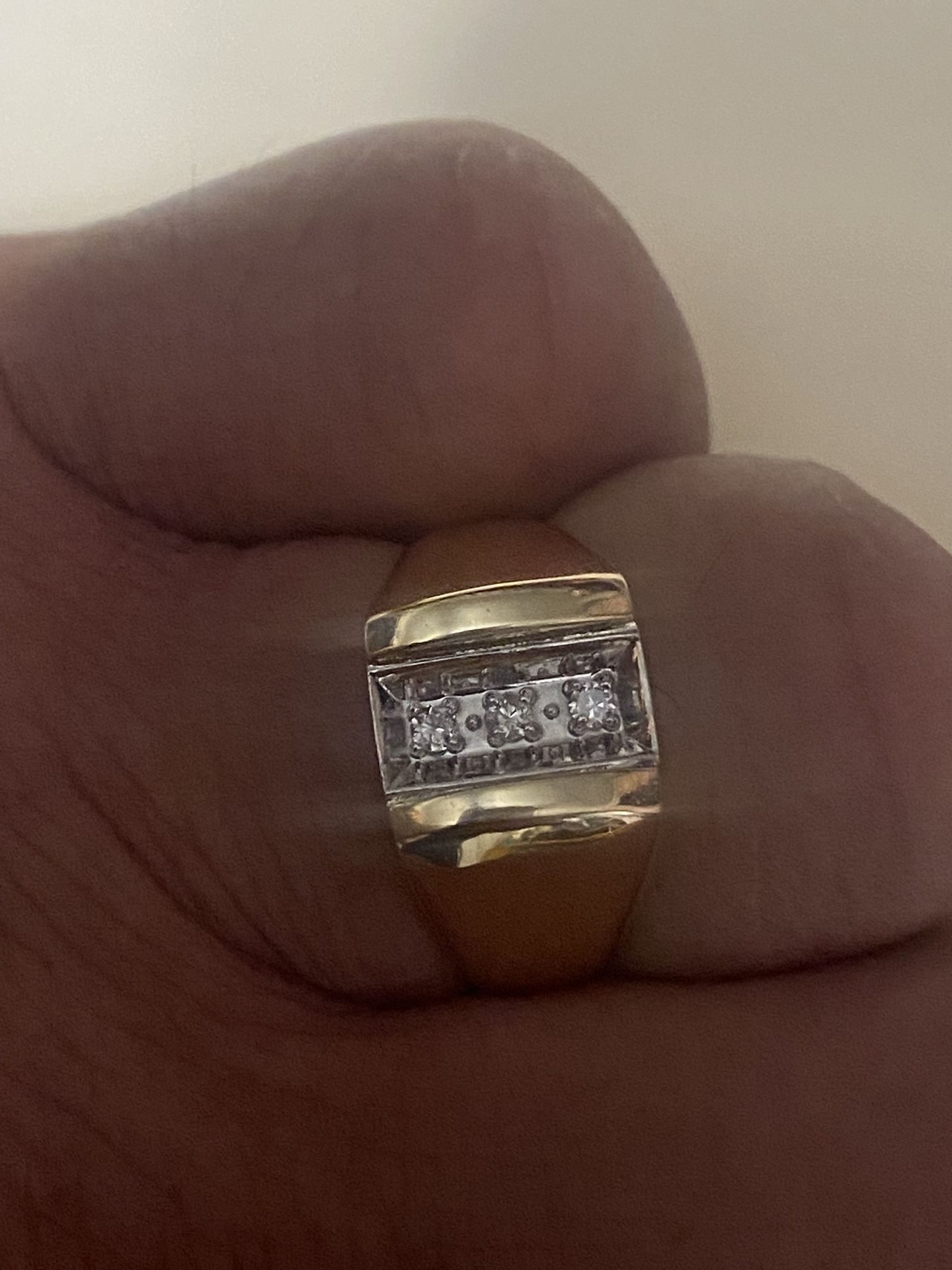 10-carat solid gold ring with three real diamonds, regular price is $1,800 I'm asking for $480 the price is firm.