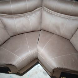 Two Brown Triangle Couches 