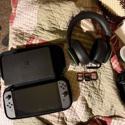 Nintendo switch oled with 3 games and gaming headphones