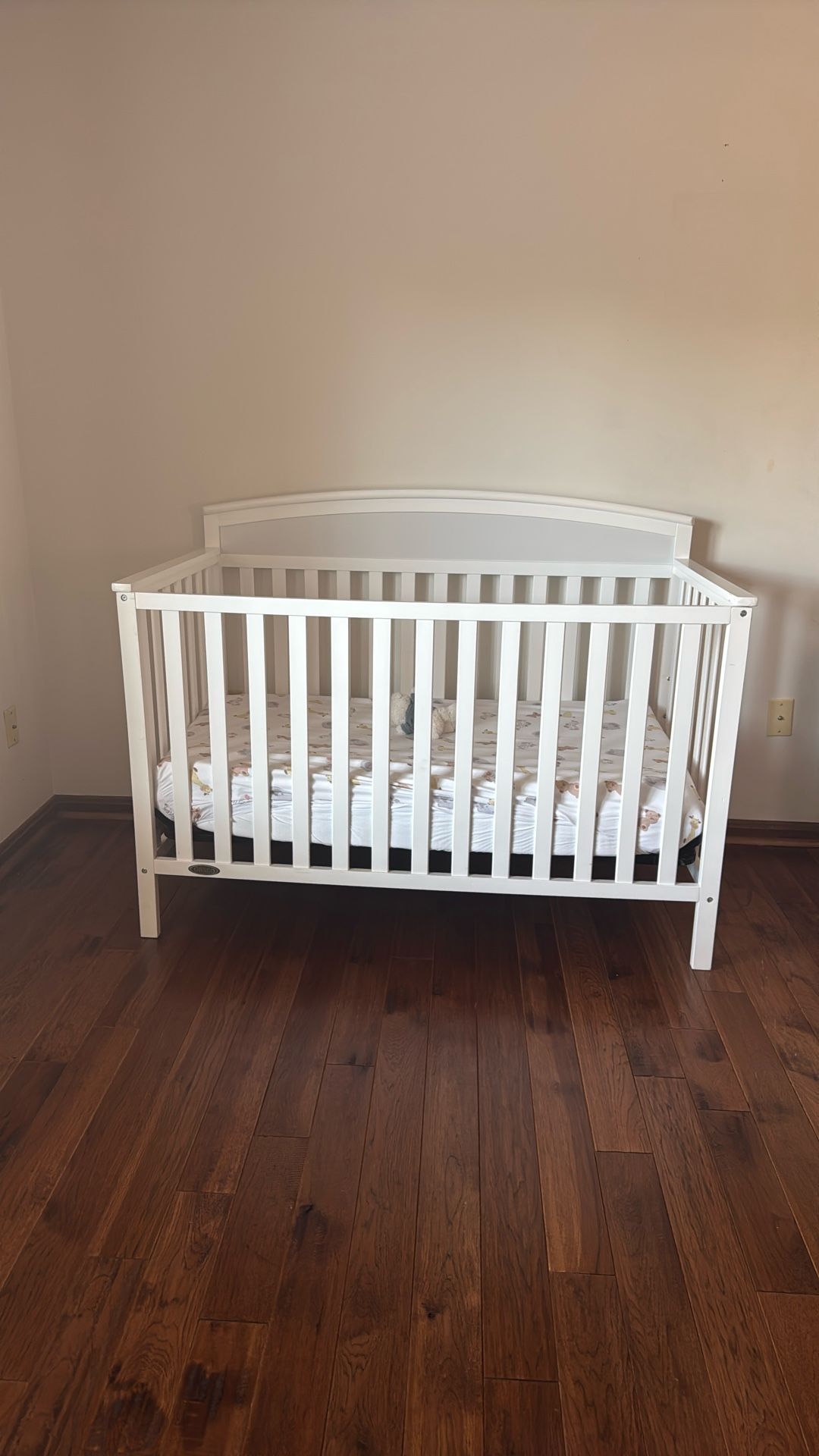 White Baby Crib With a Mattress
