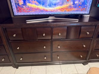 Dark Brown Wood Dresser with Silver Knobs