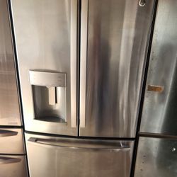 3-door refrigerator, 36 inches wide by 68.5 inches high and 29 inches deep, GE brand.