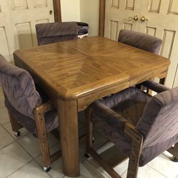 Oak Game Table With Four Rolling  Chairs