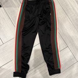 Black pants with red and green stripes