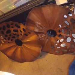 2 metal copper colored wall decor,it's 23 in round,$15 for both