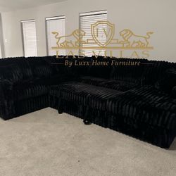 Brand New Sonic Black Sectional With Pull-Out Bed Dimension: OVERALL - 96" X 123" X 38.5"H (Chaise Depth - 61")