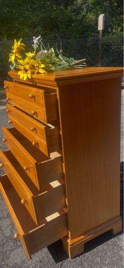 Basset solid wood tall chest with big drawers. Drawer sliding smoothly . Delivery available
