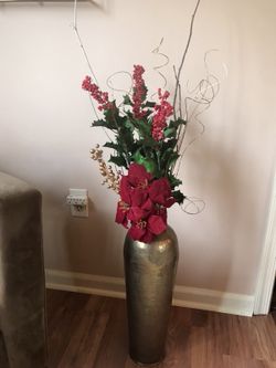 Stunning holiday floral arrangement in gold metal vase!