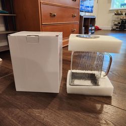New square glass pitcher, textured body, a handle, a stainless steel lid, and a silicone protective base, 10.5"×5.5"×5.5"