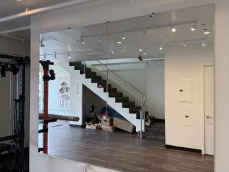 Sleek and Strong Gym Mirrors for Fitness Enthusiasts