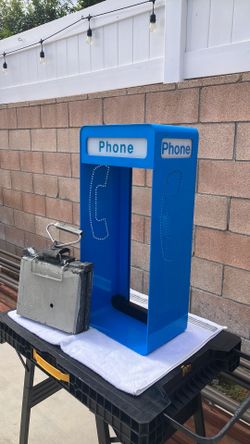 Pay phone shroud and phone book casing