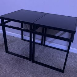 two black glass coffee tables
