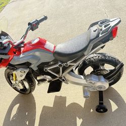 Rollplay BMW kids ride-on motorcycle.