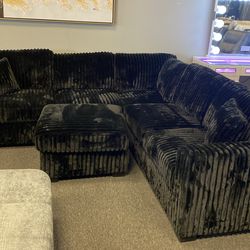 New black thick cord plush sectional with free ottoman must sell can deliver 3 left 4 colors avail