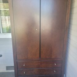 Armoire With Three Drawers and Clothes Rod