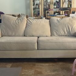 Matching sofa and loveseat, poured concrete coffee table