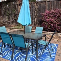 Patio Dining Set – 6 Chairs + Umbrella – $350