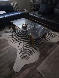 Cb2  cowhide rug zebra print