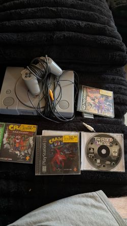 PlayStation with 4 games and remote